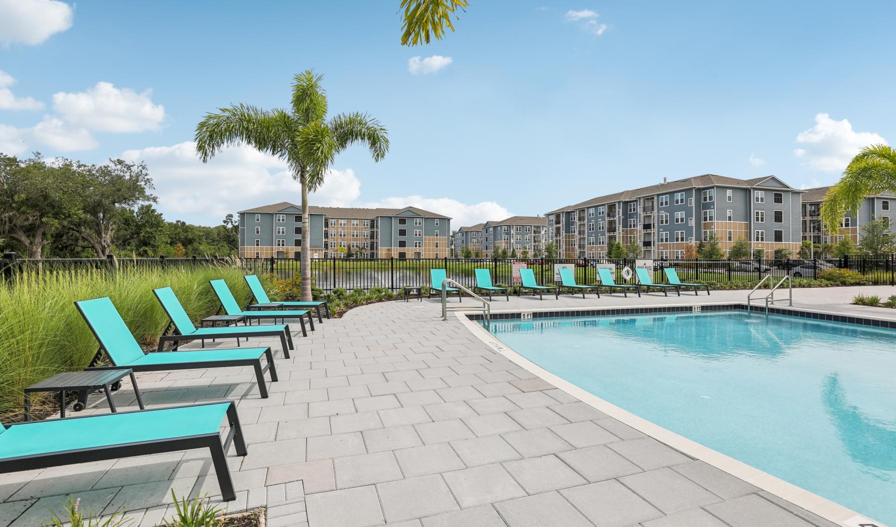 a pool with chairs around it