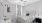 bedroom with bed ceiling fan and wall art