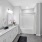 bathroom with sinks mirrors shower and a toilet