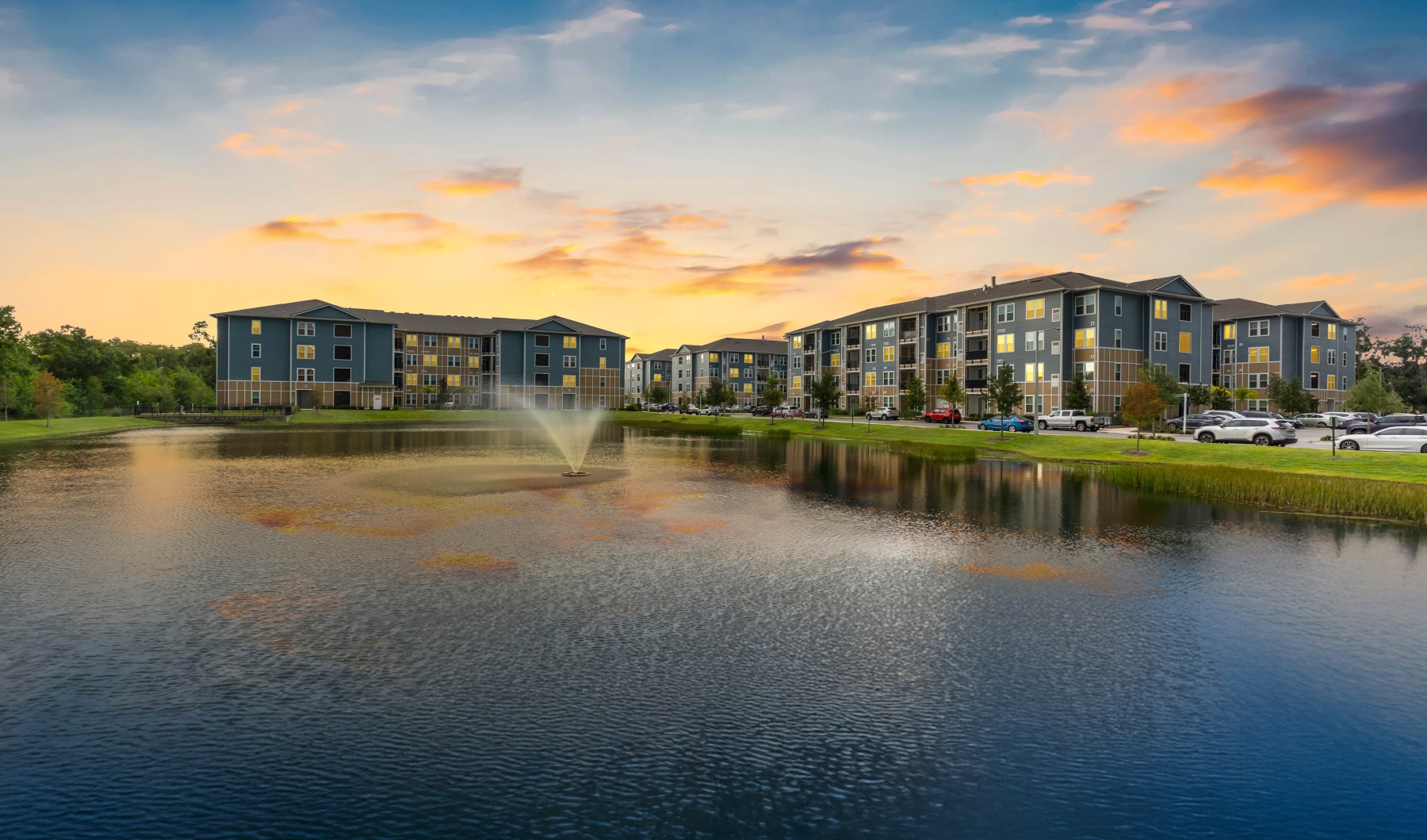 aerial photo of pond and apartment buildings